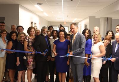 Principal Jodi Commerford officially cuts the ribbon on the new Albany High School