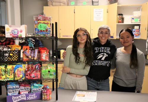 Photo of Albany Booster Club volunteers at the concession stand at a basketball game