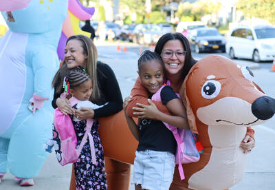 Principal Meghan D'Alessandro and Assistant Principal Allisen Brodie with two students