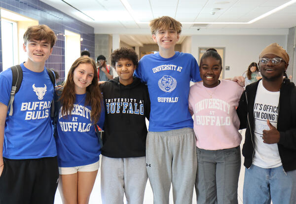 Group of six Albany High students wearing college t-shirts