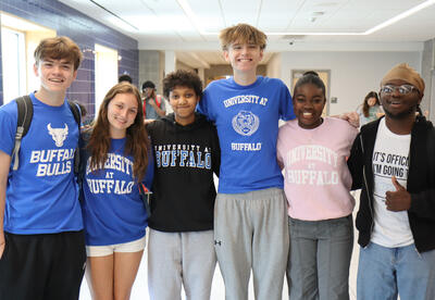 Group of six Albany High students wearing college t-shirts