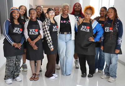 Group of 10 cosmetology students with teacher Ms. Love