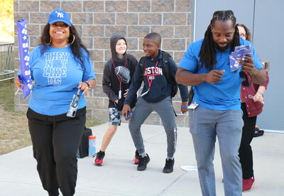 Students and staff dance at a back-to-school clap in.