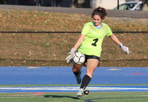 Goalie Maria Marcou-O'Malley kicking the ball back into play
