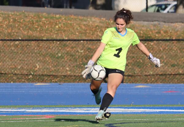 Goalie Maria Marcou-O'Malley kicking the ball back into play