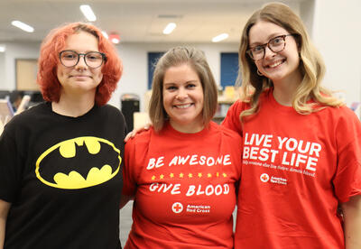Anya Miller (far right) with blood drive coordinator Alicia Abdul and another student volunteer