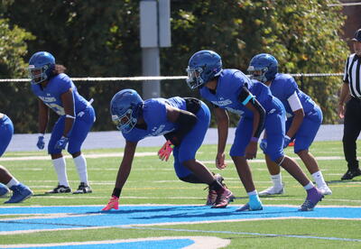 Photo of Albany High football players on the turf