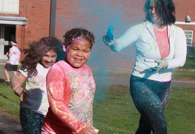 Students get blasted with color as they run