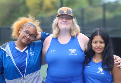 Girls' tennis seniors posing for a photo