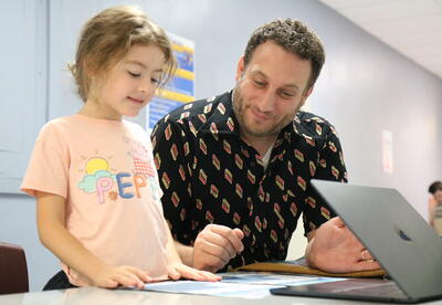 A first grader works to design an app.