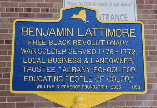 Close-up of the Benjamin Lattimore Sr. historical marker outside Giffen Memorial Elementary School