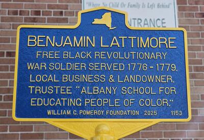 Close-up of the Benjamin Lattimore Sr. historical marker outside Giffen Memorial Elementary School