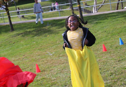 A student participates in a sack race.