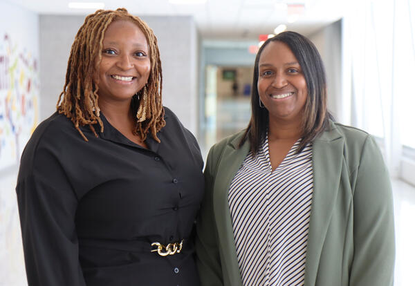 Karleen Brookshire (left) and Shanell Brown (right) standing in a hallway at Ƶ High