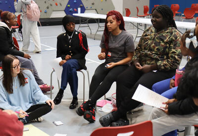 Peer group leaders discussing ground rules with their outreach group