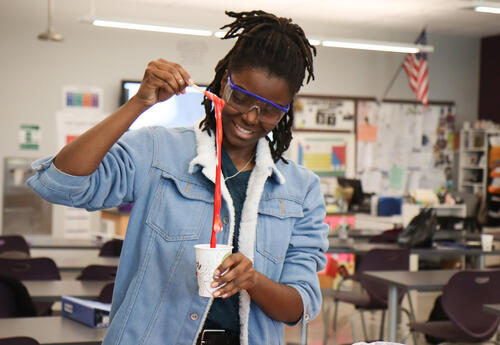 Student working with slime during the chemistry lab