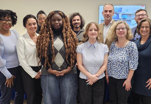 Student board reps posing with Board of Education members
