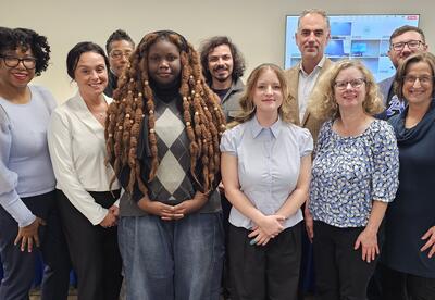 Student board reps posing with Board of Education members