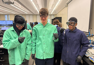 Three students working in the UAlbany lab