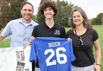 Bizer with his family on cross country senior night