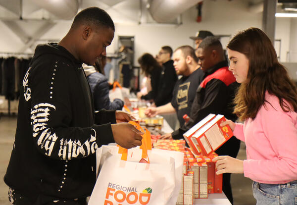 Students packing food bags at Albany High