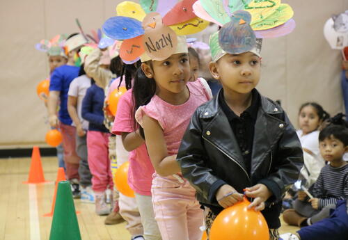 Students line up before a school-wide parade.