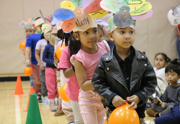 Students line up before a school-wide parade.