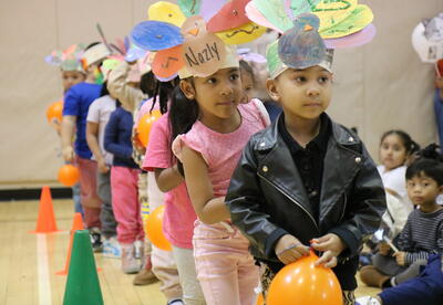 Students line up before a school-wide parade.