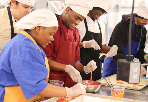 Group of students decorating sugar cookies