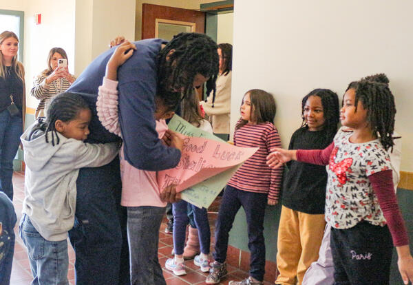 Students surround and hug Shaliem Caldwell