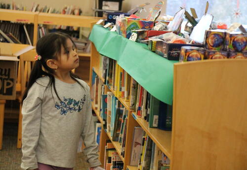 A student shops at the school's Holiday Bazaar.