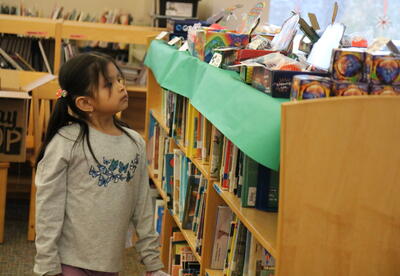 A student shops at the school's Holiday Bazaar.