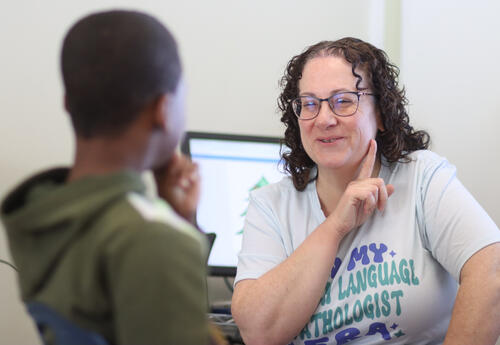 Lynn Stephens working with a student