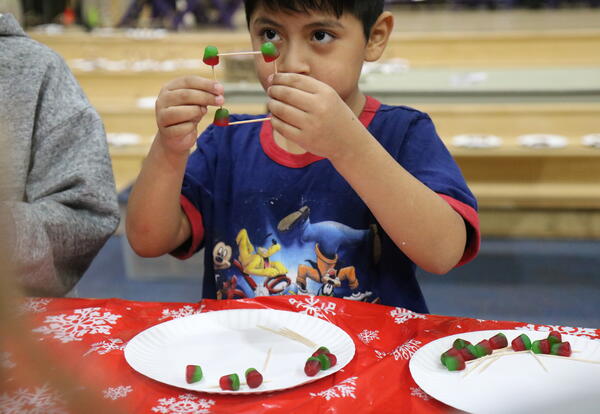 A student creates a gum drop statue.
