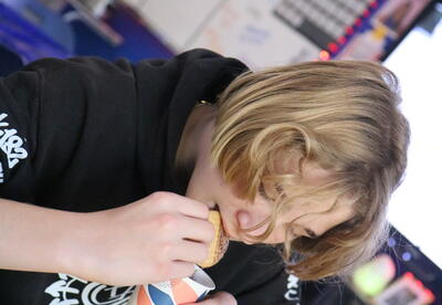 A student samples Mexican hot chocolate.