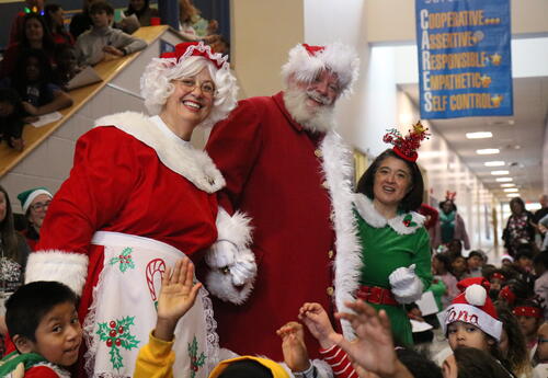 Santa and Mrs. Claus pop in to celebrate the last day of school before winter break.