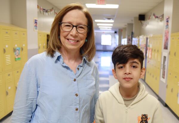 Photo of AIA teacher Laura Abate with a student