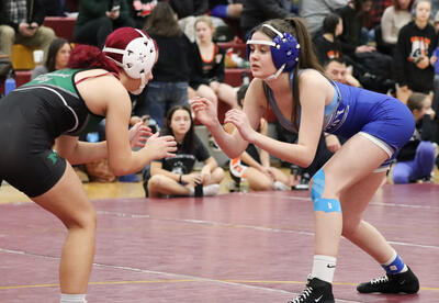 Emma Carlson facing off against an opponent