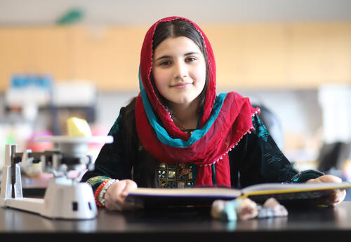 Student reading a science textbook