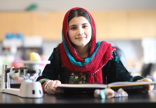 Student reading a science textbook