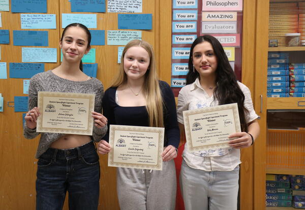 Students are awarded certificates for NASA experiment.