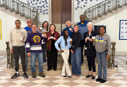 Elks Lodge members posing for a group photo with Hackett students and staff
