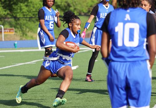 Image of students playing girls' flag football