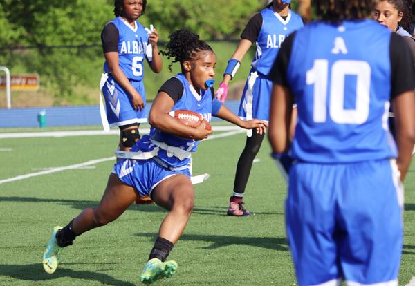 Image of students playing girls' flag football
