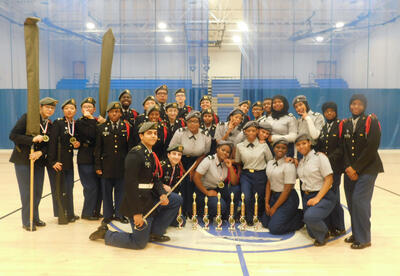 Cadets posing with the awards they won at the drill competition