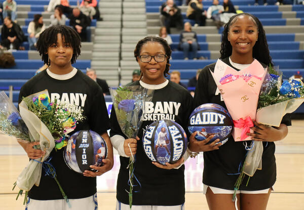 Girls' basketball seniors posing for a group photo