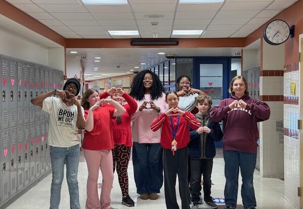 A group poses after decorating lockers.