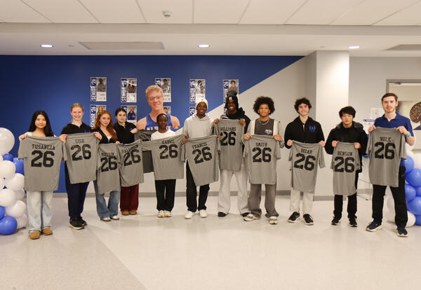 Seniors from the boys' and girls' team posing together post-ceremony