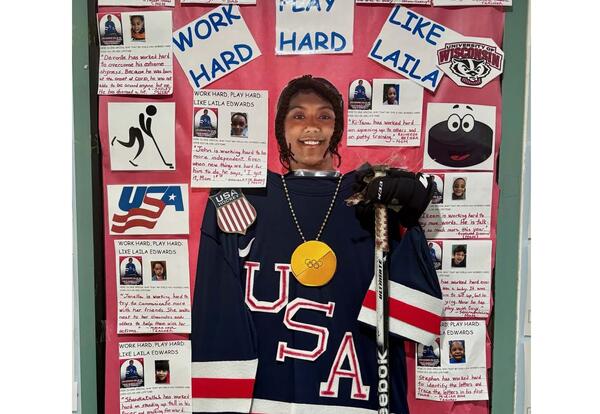 A door is decorated with a hockey player for Black History Month.