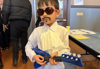 Student playing guitar